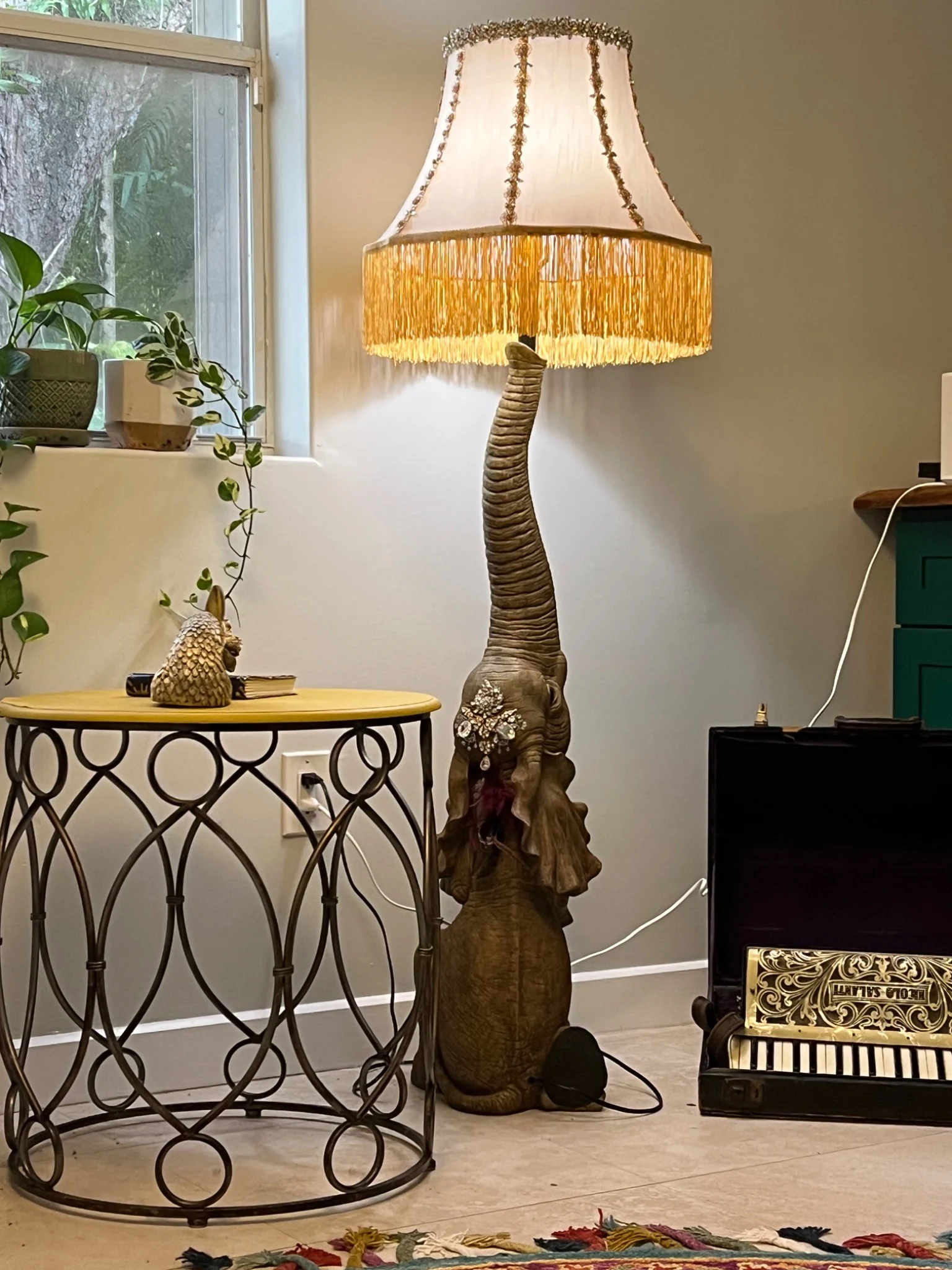 The first assembled elephant lamp with its ornate fringed shade